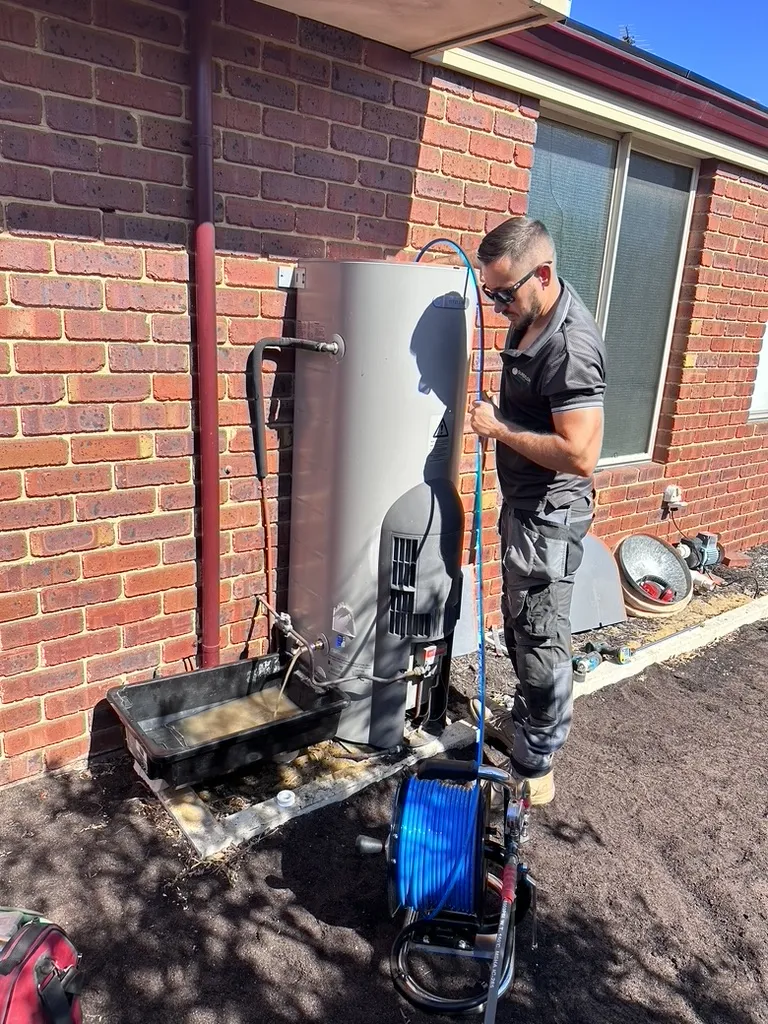 A Sureflow plumber partway through a hot water replacement